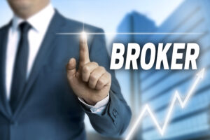 man in business suit pointing a finger with a light emitting from the tip. the word "broker" is written next to the hand in a bold font. there is a graph at the bottom