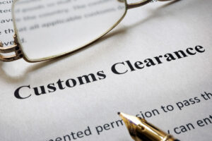 A piece of paper that reads “Customs Clearance” in black in El Paso.